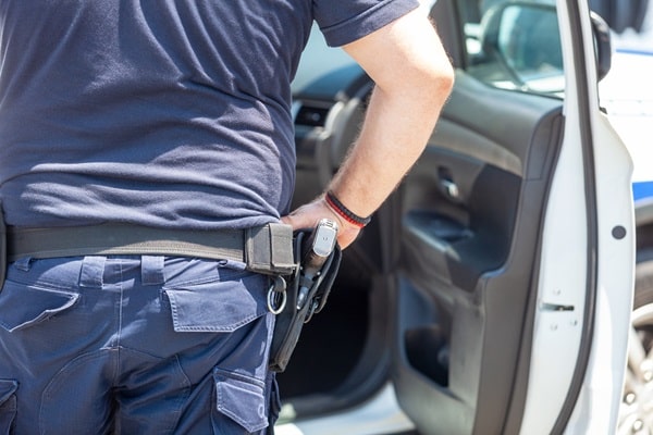 Policeman during pull over vehicle procedure